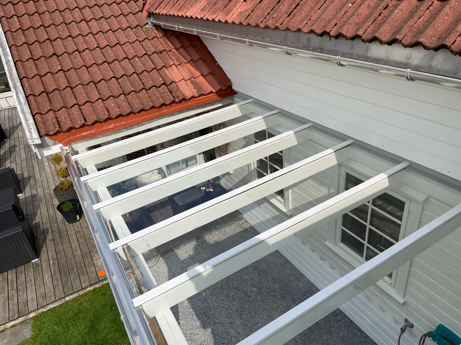 Glasstak over uteplass